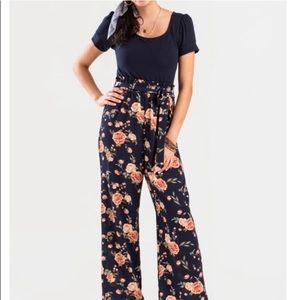 NWT Francesca’s navy and floral print jumpsuit